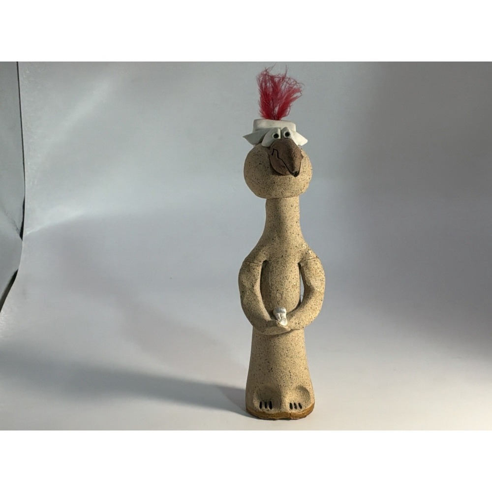 Neutral Sandstone Bird Sculpture with Red Feather Accent